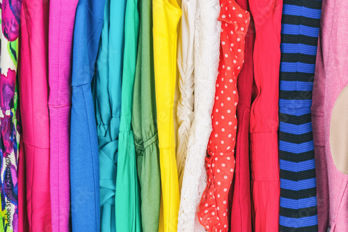 Vászonkép Closet women's fashion outfits clothes arranged in rainbow colors assorted