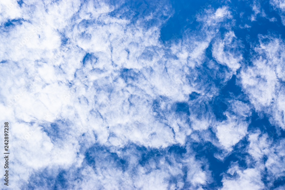 White clouds on a blue sky, texture background. White clouds on a blue sky, texture background.