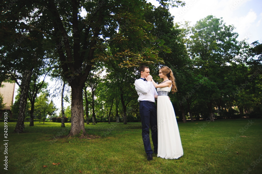Wedding day. bride and groom outdoor in nature location. Wedding couple in love at wedding day. Wedding day. bride and groom outdoor in nature location. Wedding couple in love at wedding day.