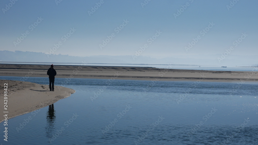 Lone Man on Beach by Estuary