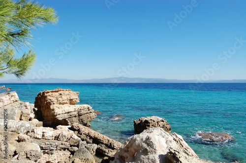 Scenic seascape with stone coast and turquoise sea in Greece.