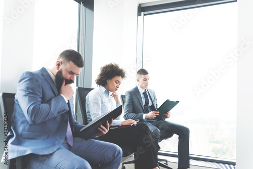 Businesspeople in waiting room for job interview