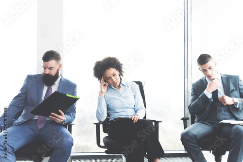Tapeta Businesspeople in waiting room for job interview
