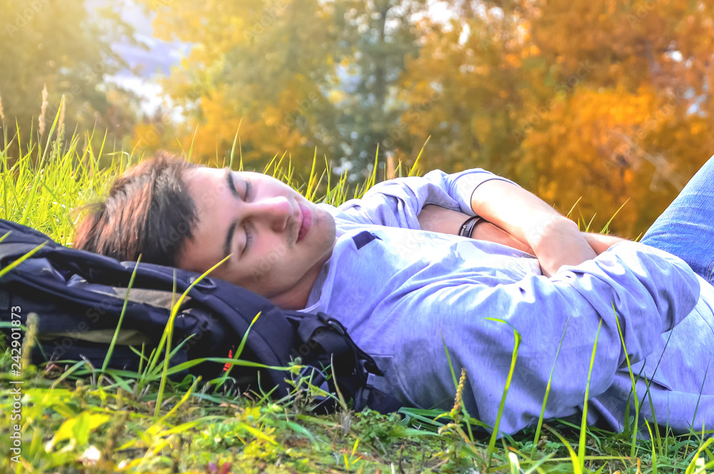 young man in the field of flowers young man in the field of flowers