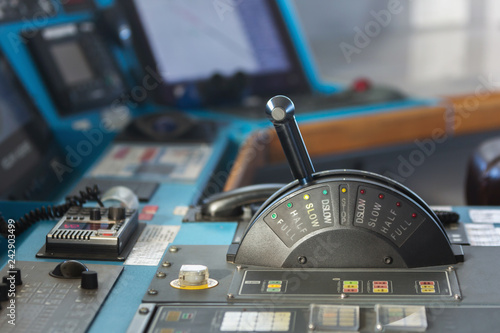 Control panel of a cargo merchant ship with stick in slow ahead mode.