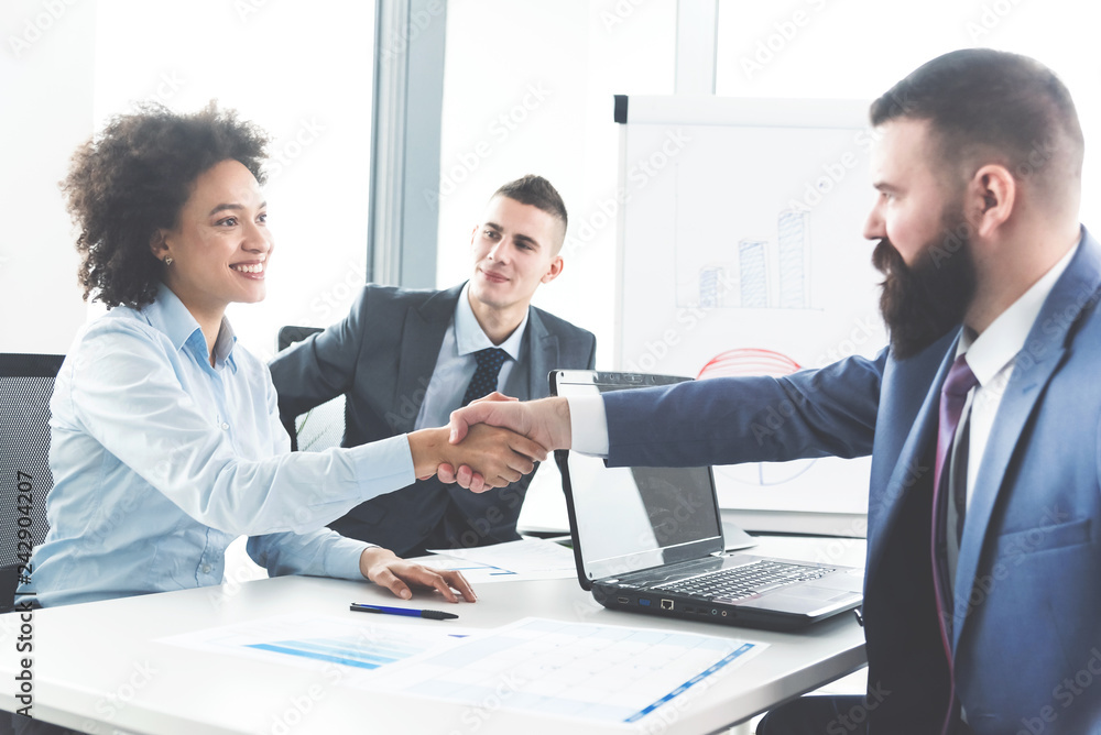 Businesspeople handshaking Businesspeople handshaking
