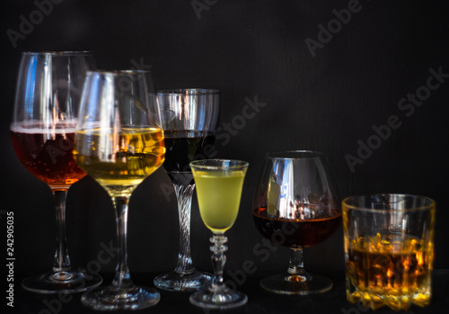 Glassed with drinks on dark background