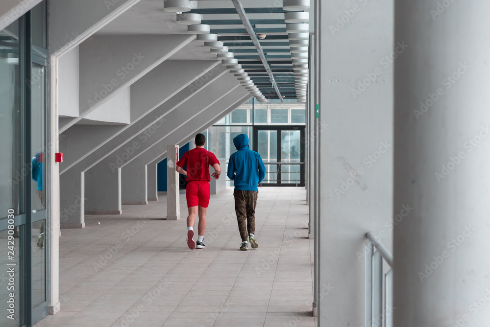 two friends runing and practice in the hall