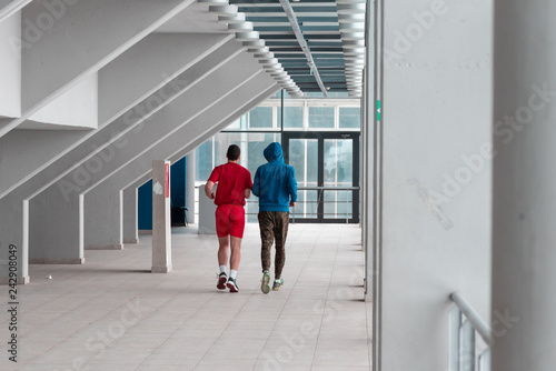 two friends runing and practice in the hall