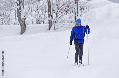Cross-country skiing. Young man doing outdoor exercise. Winter sport and healthy lifestyle.