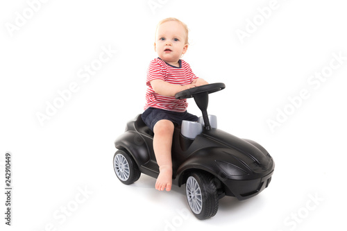 Child sitting on a gurney isolated on white background