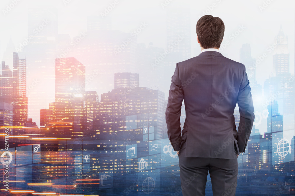Rear view of businessman looking at interface Rear view of businessman looking at interface