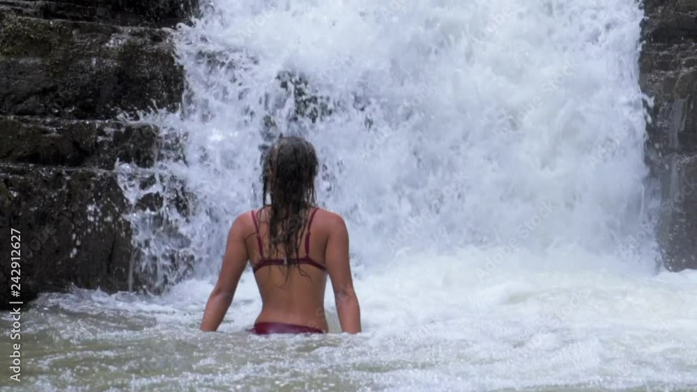 Slow Motion: Sexy Woman Bathing at the Bottom of Waterfall Slow Motion: Sexy Woman Bathing at the Bottom of Waterfall