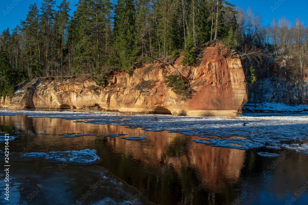 sandstone cliffs on the shore of river Gauja in Latvia