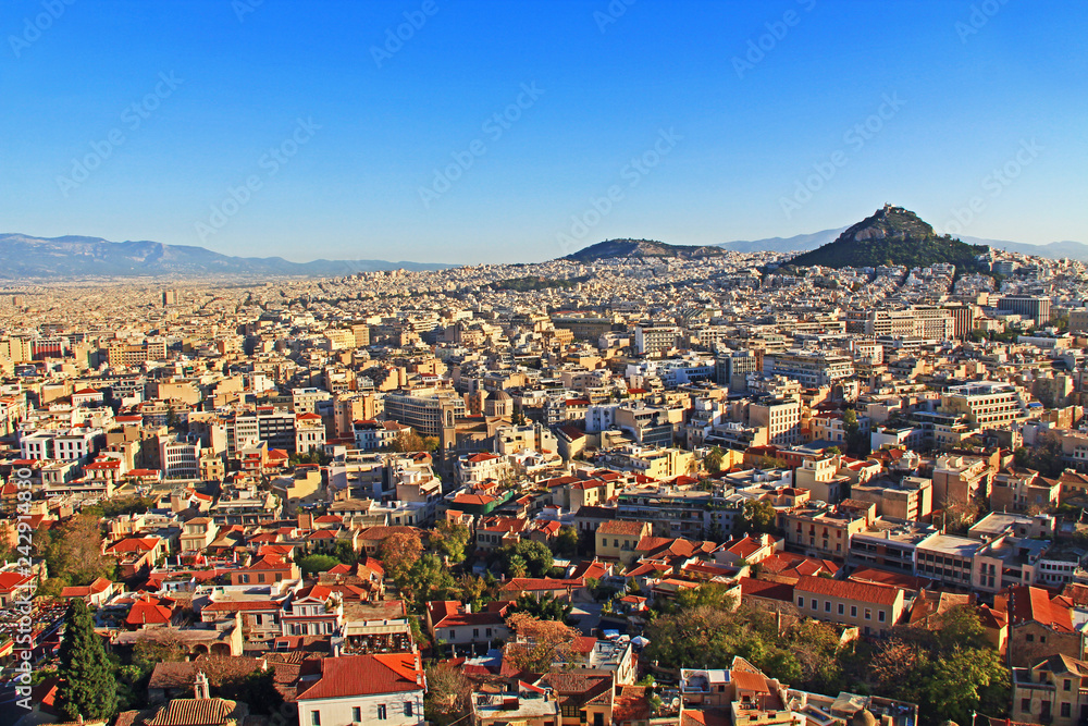 Mount Lycabettus and the city of Athens, Greece as seen from Acropolis hill with blue sky copy space. 
