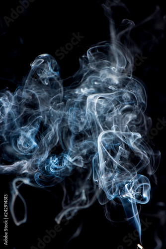 white smoke on black background © Martins Vanags
