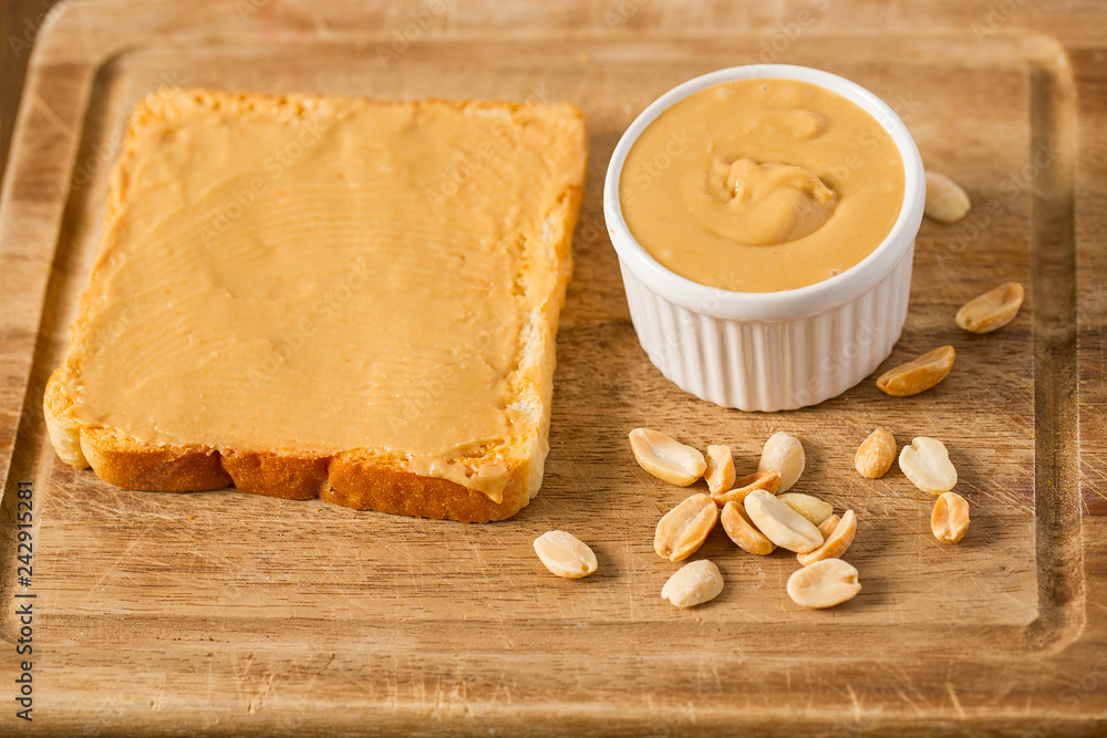 Peanut butter sandwich on wooden surface Peanut butter sandwich on wooden surface