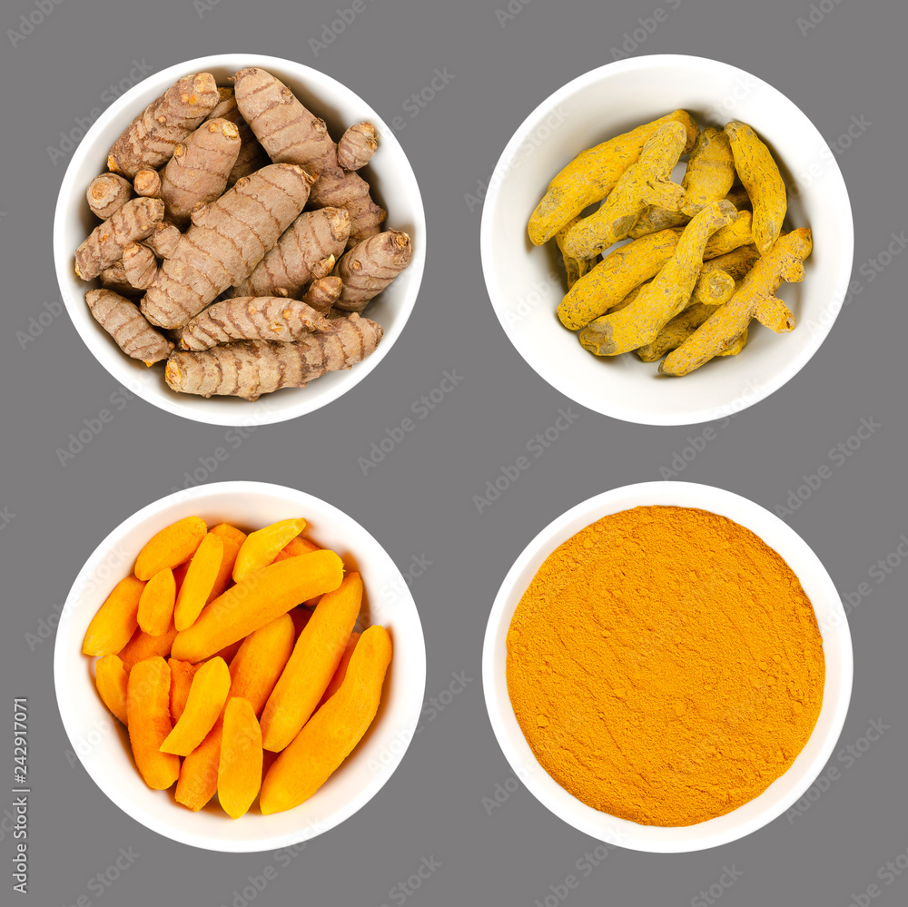 Turmeric in white bowls. Fresh rhizomes, whole and peeled, processed and powder. Curcuma longa