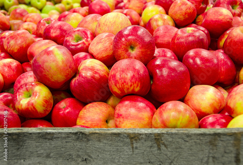 red and yellow Michigan apples in rustic wooden crate