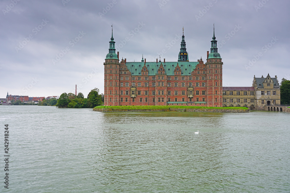 View of the Frederiksborg Castle, a landmark historic a palatial complex located in Hillerød, Denmark. View of the Frederiksborg Castle, a landmark historic a palatial complex located in Hillerød, Denmark.