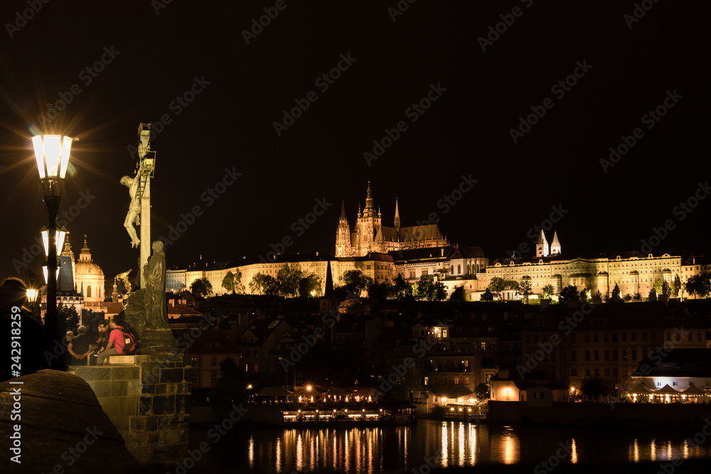 The View of Prague Gothic Castle with Charles Bridge at night, Czech Republic