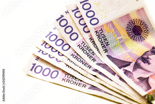 Canvas Print Transfer twisted banknotes. Money in hand close-up.