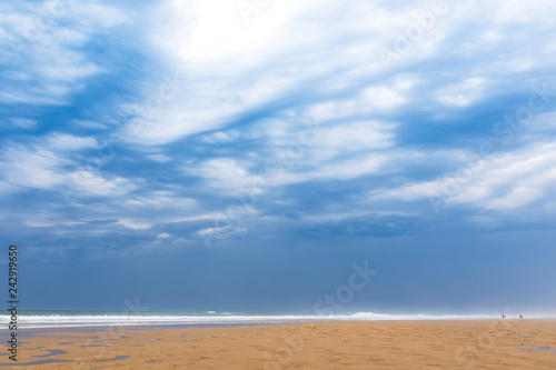 Fototapeta Naklejka Na Ścianę i Meble -  Ocean beach on the Atlantic coast of France near Lacanau-Ocean, Bordeaux, France. Windy and cloudy summer day