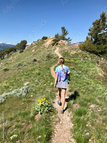 young woman hiking in the mountains