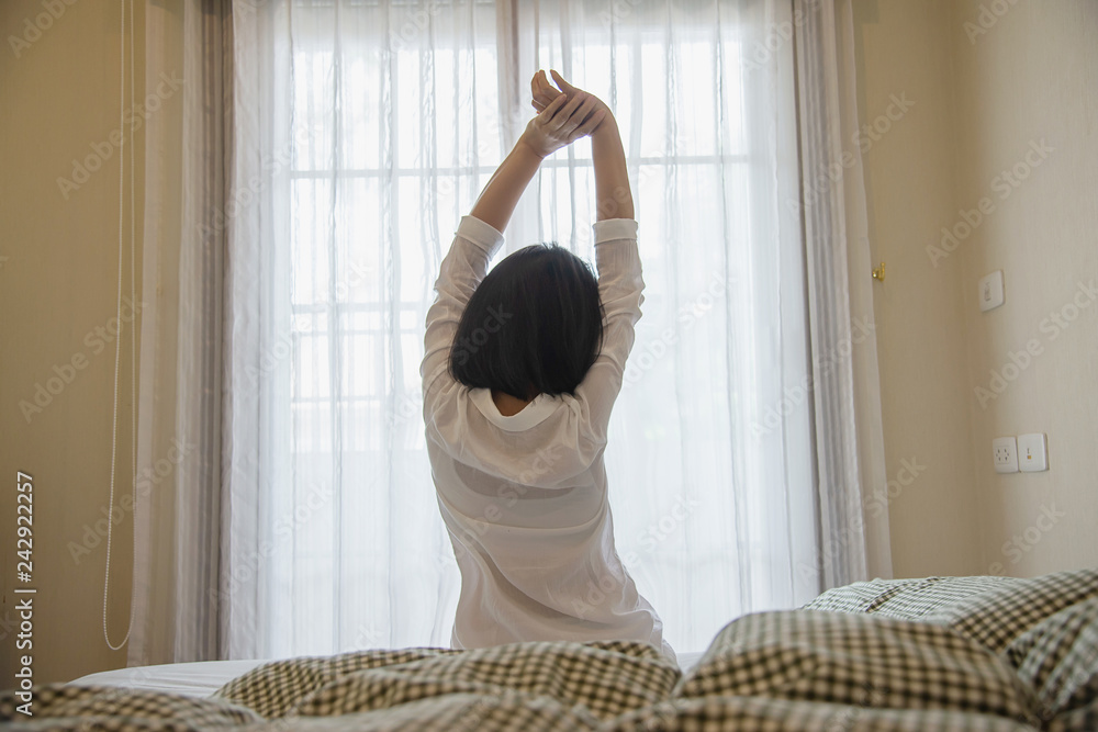 Fototapeta premium Lady wake up stretch oneself lazily for fresh morning - health care concept