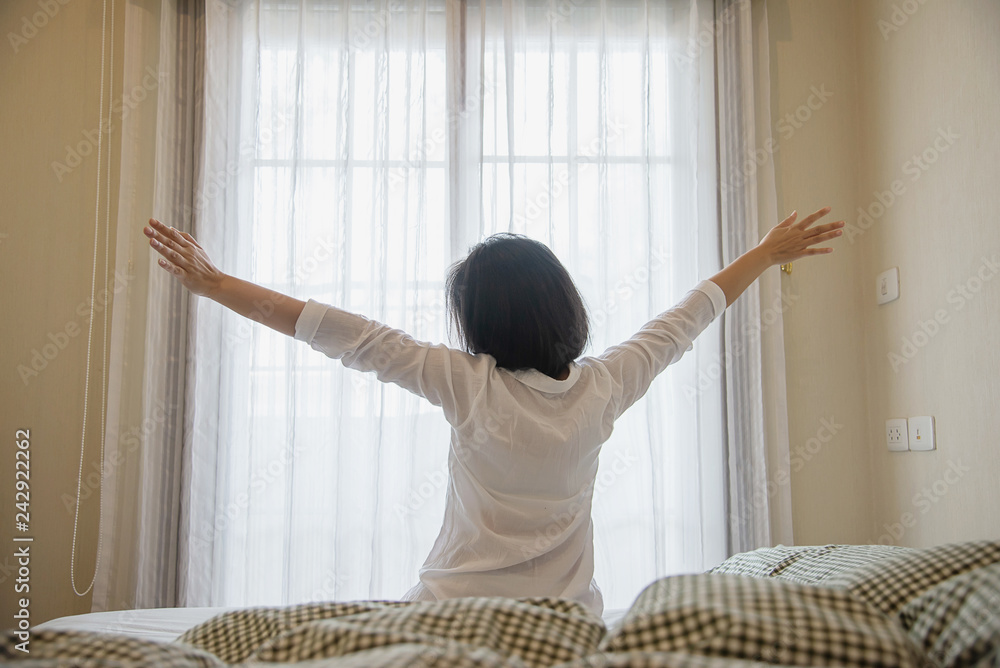 Lady wake up stretch oneself lazily for fresh morning - health care concept