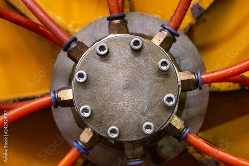 Ferrous lid of distributive box of the pneumatic system of industrial equipment with eight timber screw-bolts..