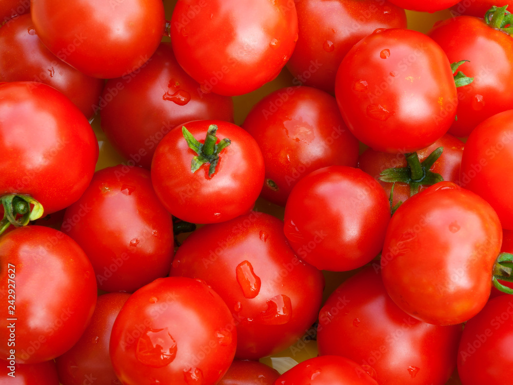 many cherry tomatoes red background top view many cherry tomatoes red background top view