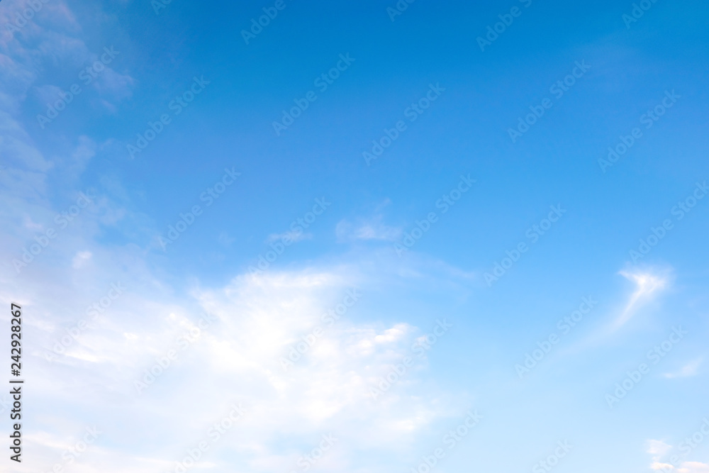 Beautiful white clouds with blue sky.Color shade gradient from white to blue for background wallpaper.;