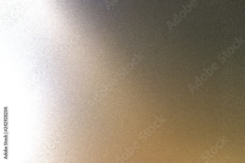 Light shining on rough black metal wall texture, abstract background