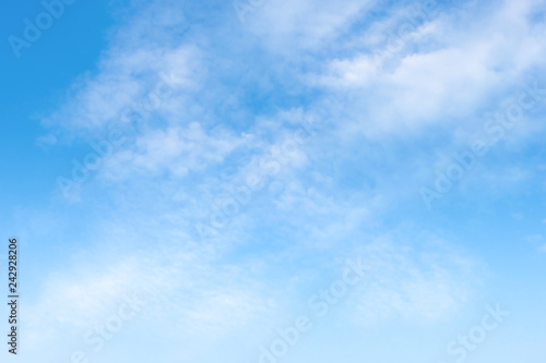 Beautiful white clouds with blue sky.Color shade gradient from white to blue for background wallpaper.;