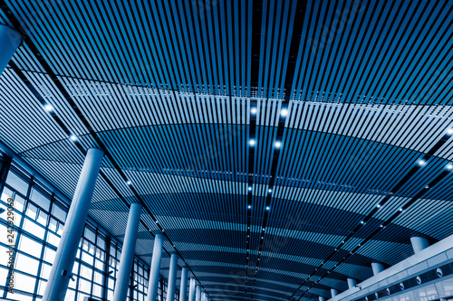 low angle view of steel glass airport ceiling, shenzhen china,blue toned image.