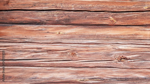 Old dark log. Background of cracked logs.  