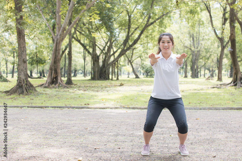 Strong healthy concept, women exercise in park Strong healthy concept, women exercise in park