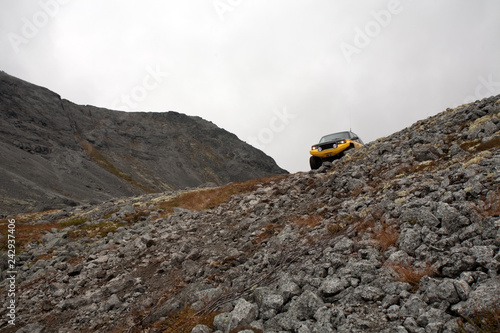 big off-road SUV car on stony mountain