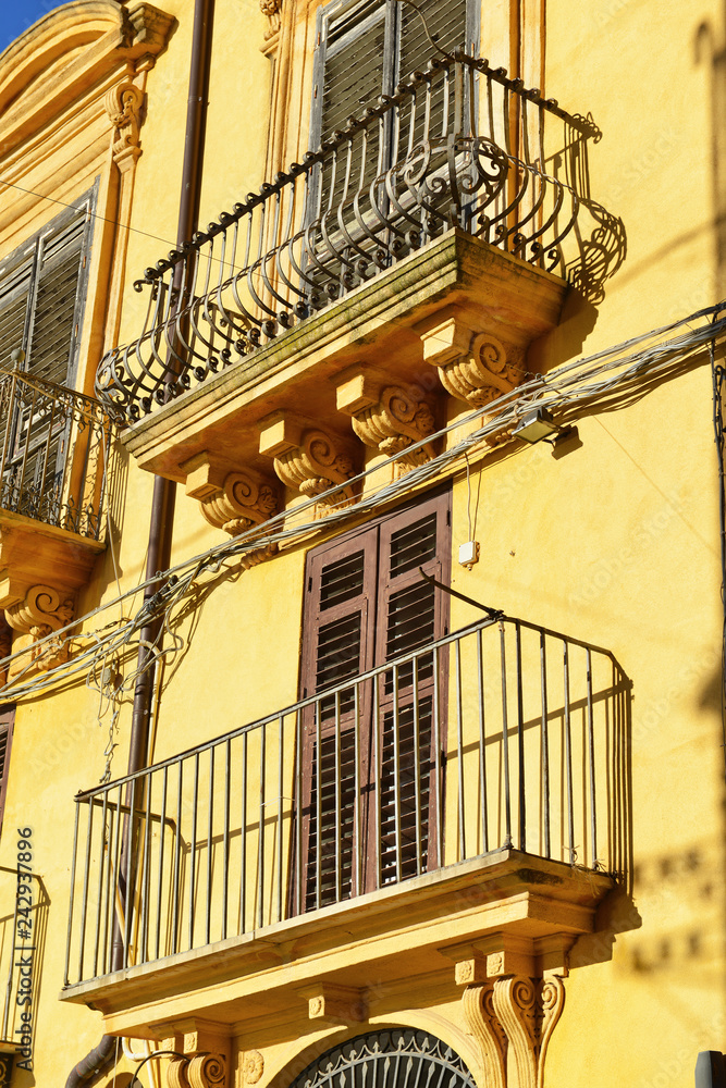 Traditional colorful vintage architecture in small town in Sicily, Italy