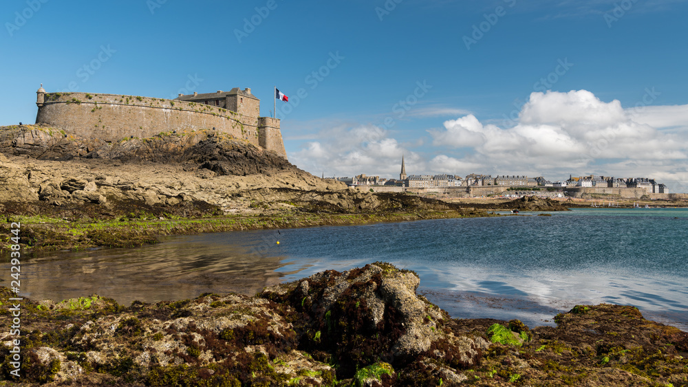 Fort on the island Petit-Be, Saint-Malo at low tide on a sunny day in summer