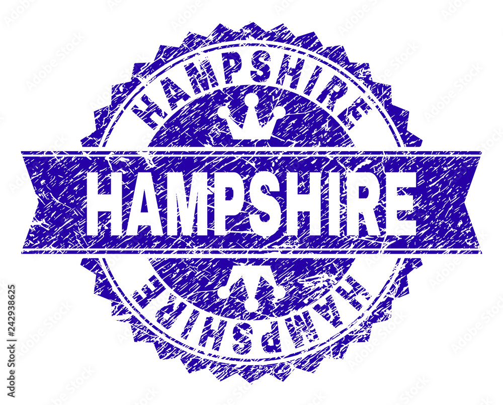 HAMPSHIRE rosette seal imprint with grunge texture. Designed with round rosette, ribbon and small crowns. Blue vector rubber print of HAMPSHIRE label with grunge style.