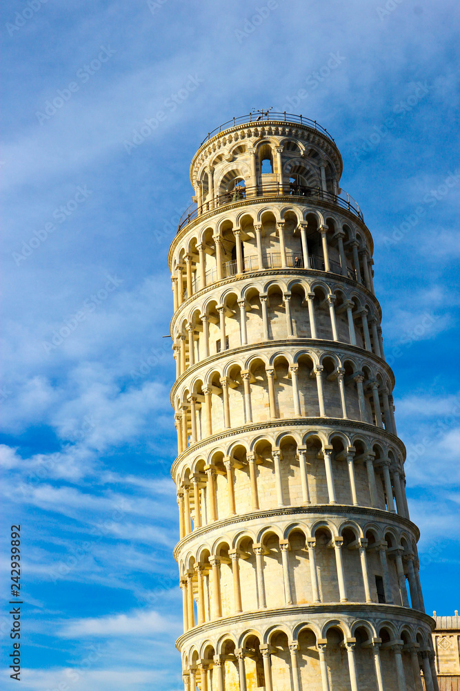 Leaning tower of pisa winter view with a sky and clouds, Tuscany, Italy