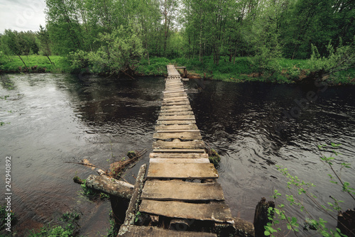 old wooden bridge over the river 