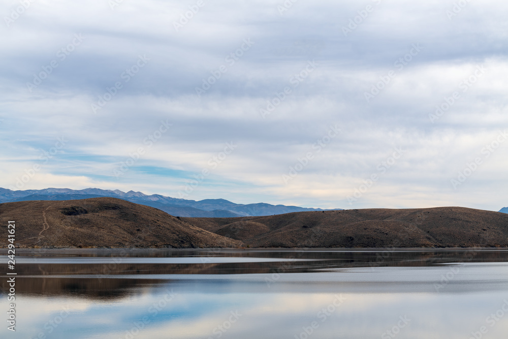 Mountains and sky reflected in Topaz Lake on the Nevada California border, USA