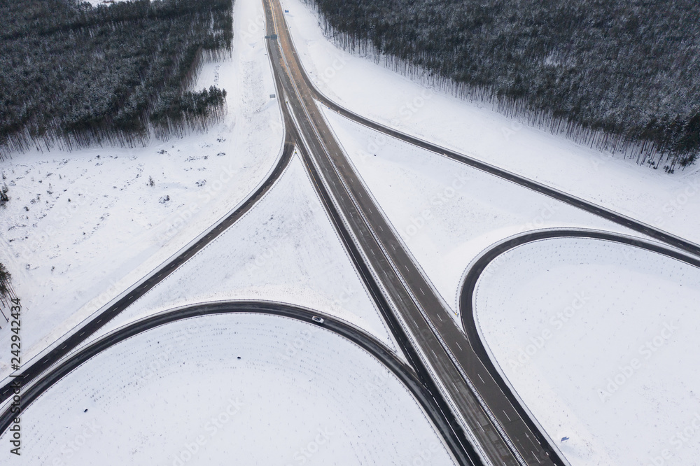 Winter snowy Highway with road junction view from above