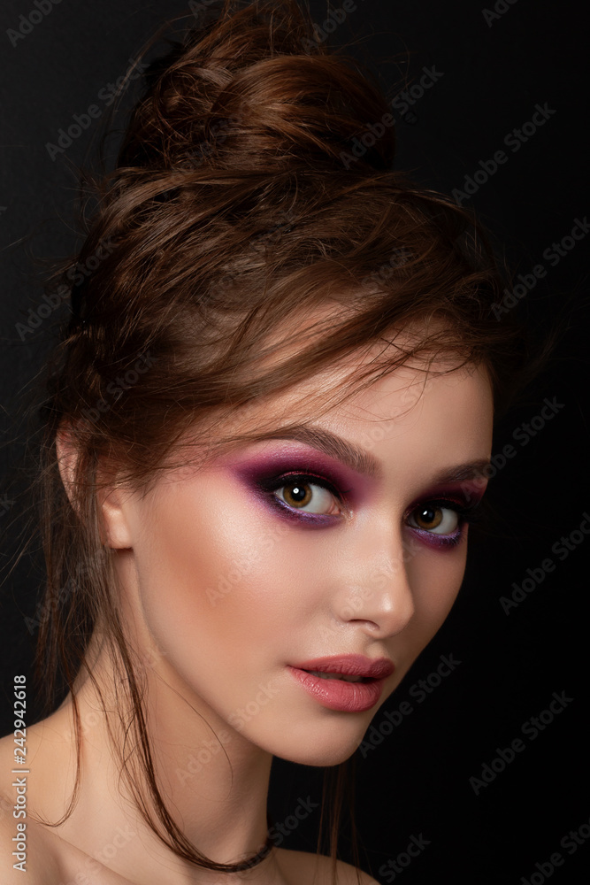 Closeup portrait of young beautiful woman with bright pink smokey eyes. Fashion makeup. Studio shot. Modern bright summer make up Closeup portrait of young beautiful woman with bright pink smokey eyes. Fashion makeup. Studio shot. Modern bright summer make up