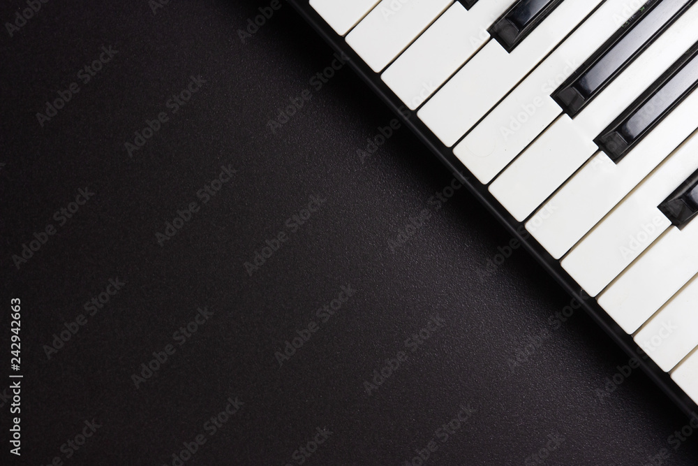 Piano keys on black background