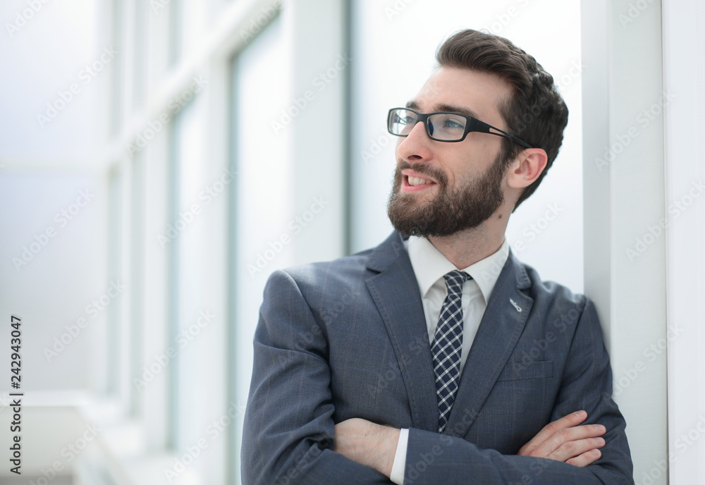 close up.pensive businessman standing in the office close up.pensive businessman standing in the office