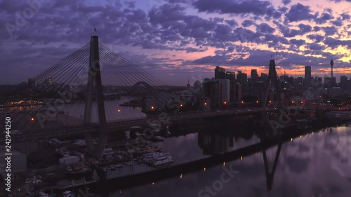 Drone aerial view of the Anzac Bridge with the sydney city skyline in the background